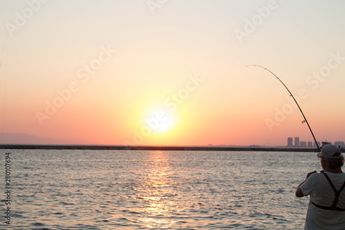 fisherman catching sun