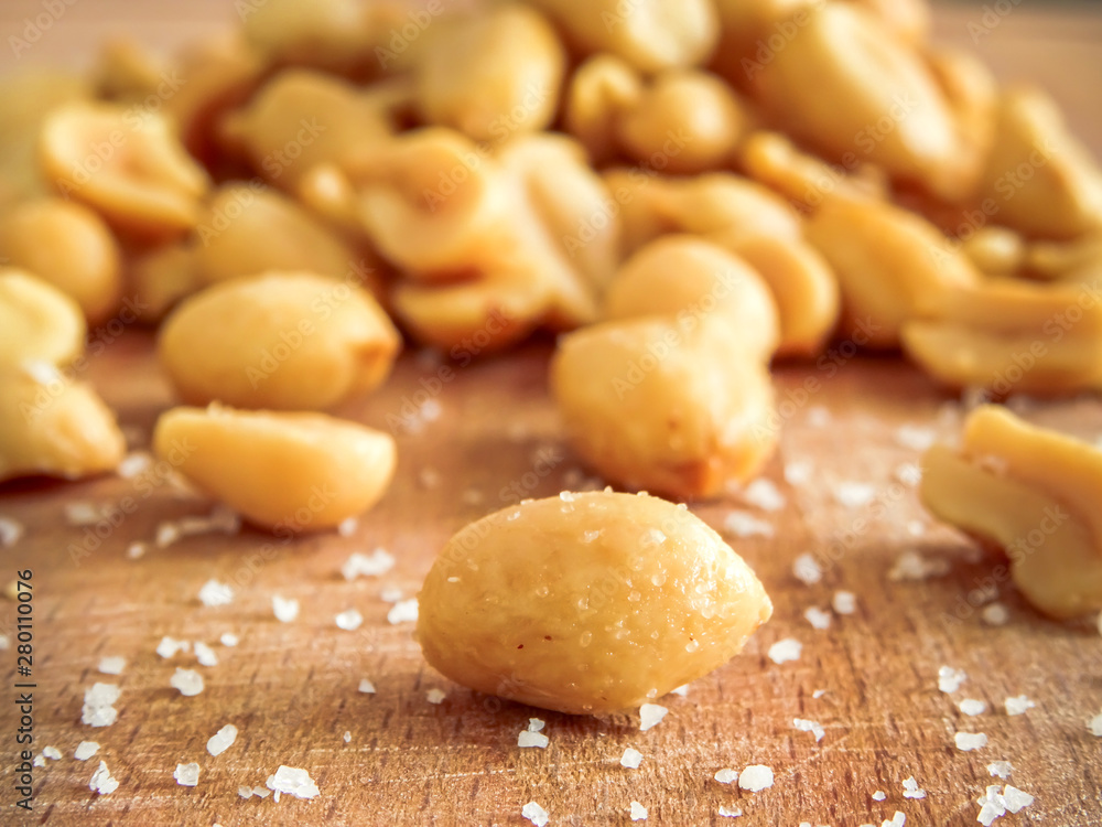 peanut on the wooden and blurry background salty close up peanut on the wooden and blurry background salty close up