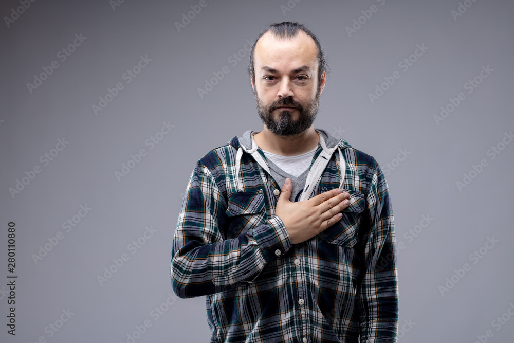 Patriotic or sincere man placing hand on heart Patriotic or sincere man placing hand on heart