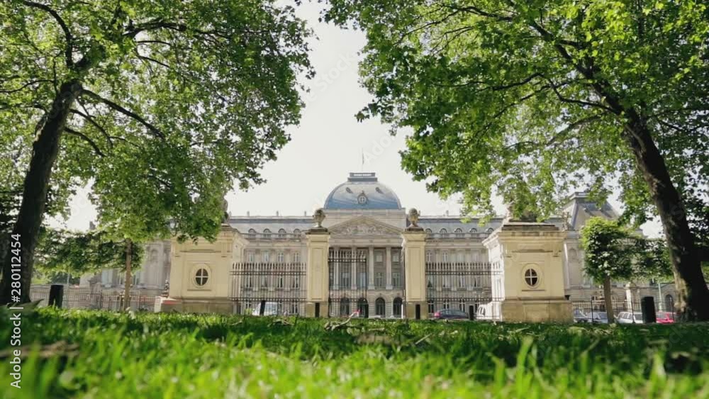 Facade of Old Building Arhitecture Royal Palace of Brussels in Belgium. View through Gate in City Park at Summer Day Facade of Old Building Arhitecture Royal Palace of Brussels in Belgium. View through Gate in City Park at Summer Day
