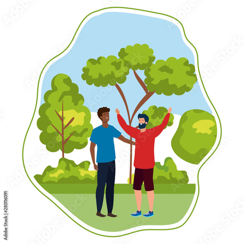 interracial young men friends celebrating in the park