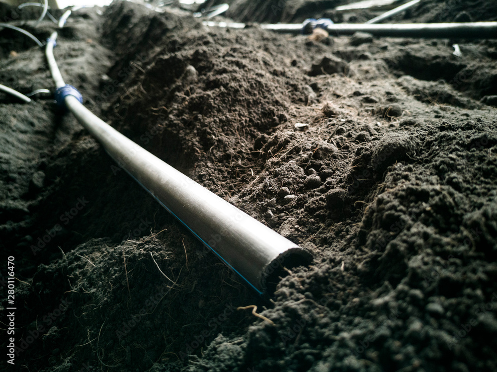 Watering system hose installed in the soil