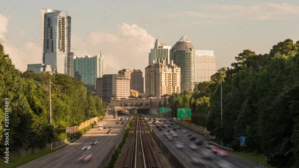 Atlanta skyline view of the Buckhead district from the GA 400 highway as rush hour is at it's peak in the evening hours. Atlanta skyline view of the Buckhead district from the GA 400 highway as rush hour is at it's peak in the evening hours.