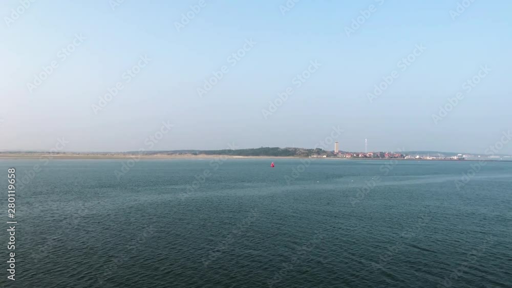 Aerial dolly in towards the island of Terschelling in The Netherlands. Aerial dolly in towards the island of Terschelling in The Netherlands.