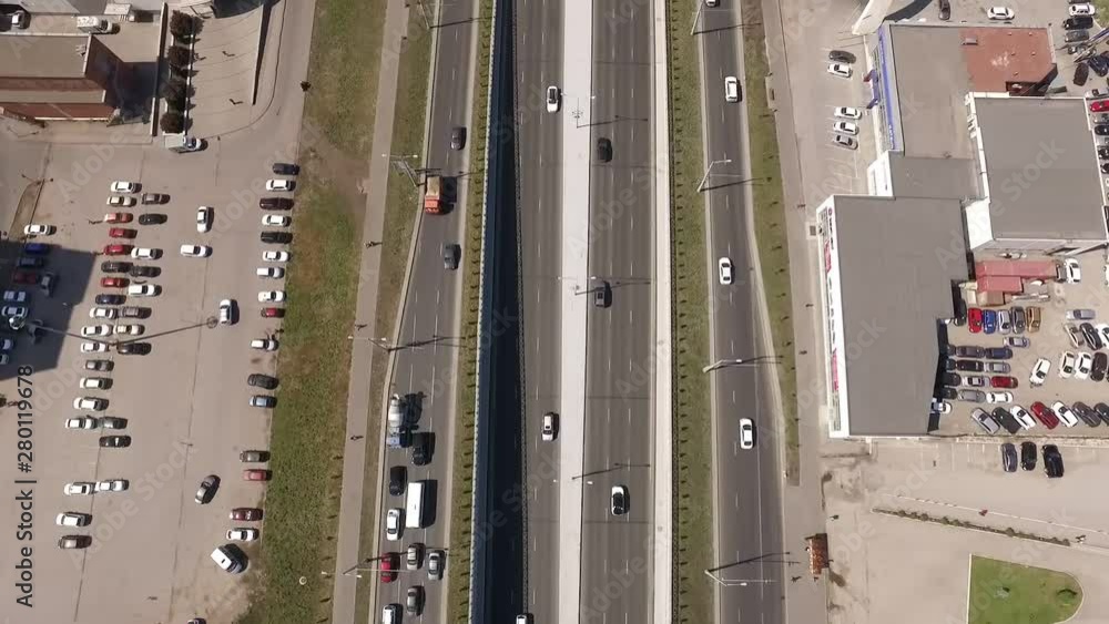 car traffic on road and parking area in city, moving aerial view car traffic on road and parking area in city, moving aerial view