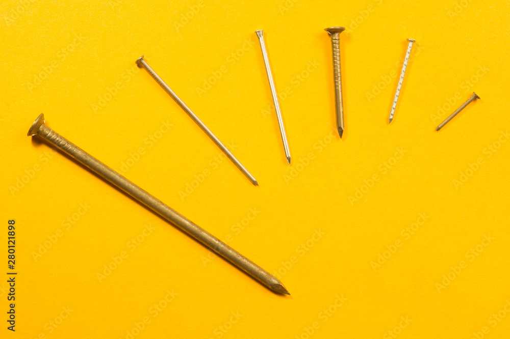 Nails on a yellow background Nails on a yellow background