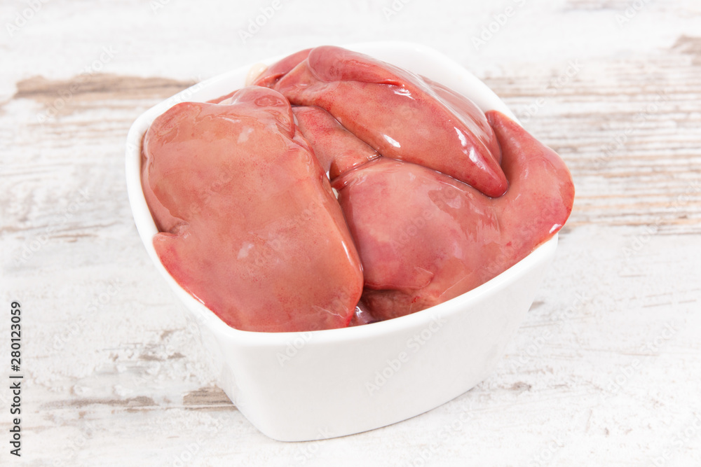 Chicken liver in glass bowl, healthy nutrition as source minerals Chicken liver in glass bowl, healthy nutrition as source minerals