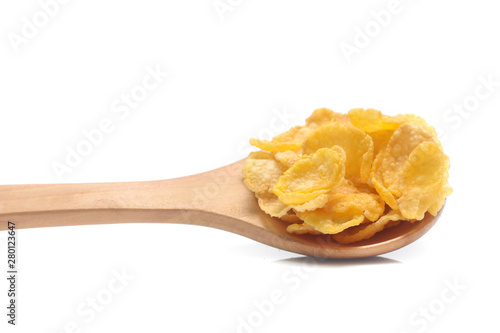 Cornflakes on spoon wood isolated on white background