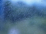 Motion drop rain on mirror window glass car in road rainy season