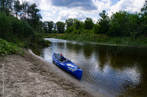One kayak on the banks of the river