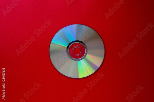 cd compact disc on a Dark red background top view with copy space 