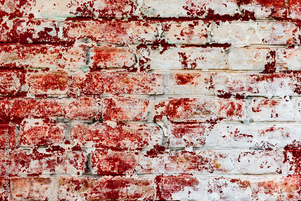 Obraz premium Texture of a brick wall with cracks and scratches which can be used as a background