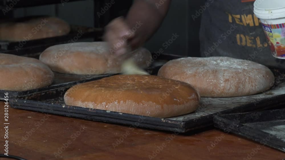 Smearing Buns With Glaze.Baker Fresh Baked Bread. Fresh Bakery Smearing Buns With Glaze.Baker Fresh Baked Bread. Fresh Bakery