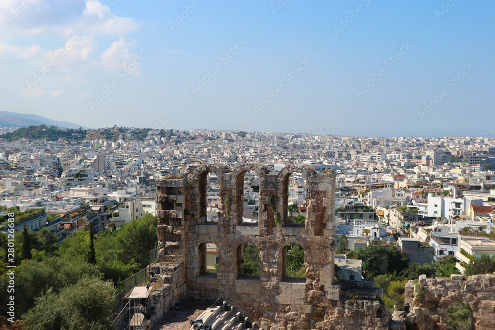 The famous Herod Atticus Odeon theatre on the western end on the south slope of the Acropolis of Athens greece with the city on the background