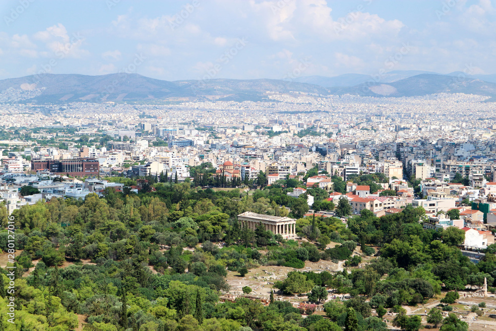 Scenic panoramic aerial view of the white city Athens Greece from acropolis under summer blue sky with clouds