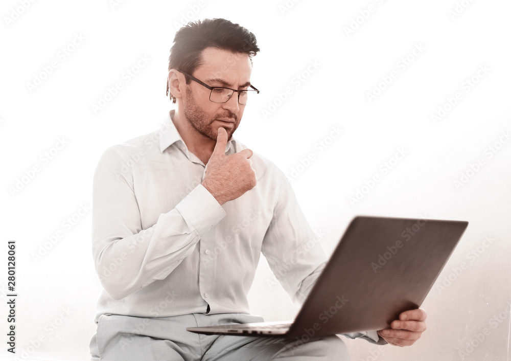 close up.serious businessman typing text on laptop close up.serious businessman typing text on laptop