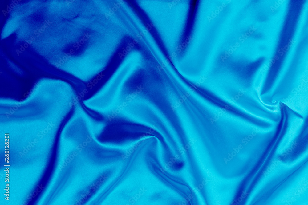 Blue satin fabric texture background Blue satin fabric texture background