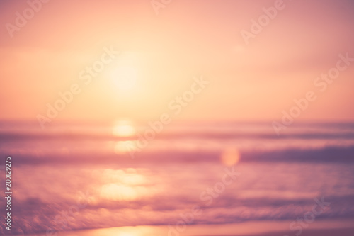 Copy space of soft sand sea and blur tropical beach with sunset sky and cloud abstract background. © tonktiti