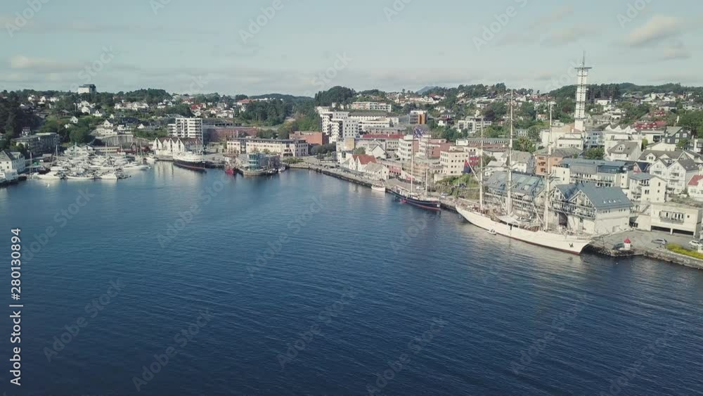 Drone flying towards Stord City Harbour in western Norway. Drone flying towards Stord City Harbour in western Norway.