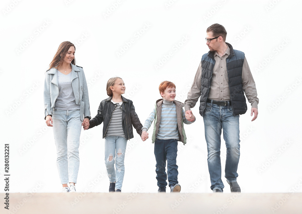 Fototapeta premium happy family walking, holding each other's hands.