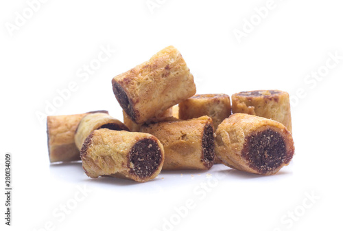 sweet dessert chocolate biscuit roll isolated on white background photo