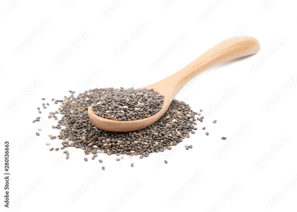 Chia seeds in a wooden spoon isolated on white background. Chia seeds in a wooden spoon isolated on white background.
