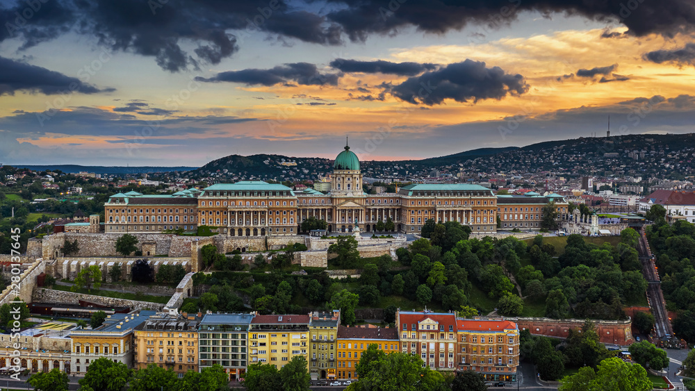 Budapest, Hungary - Dramatic golden sunset over Buda Castle Royal Palace at summer time taken with a drone