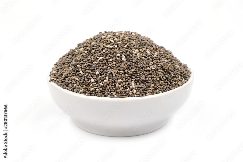 Chia seeds in a white bowl isolated on white background. Chia seeds in a white bowl isolated on white background.
