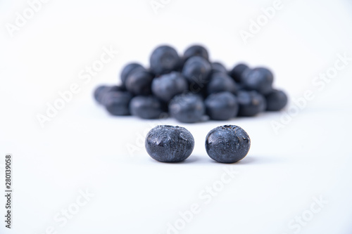 Delicious bunch of blueberries - Ripe blueberries - Two wet and ripe blueberries