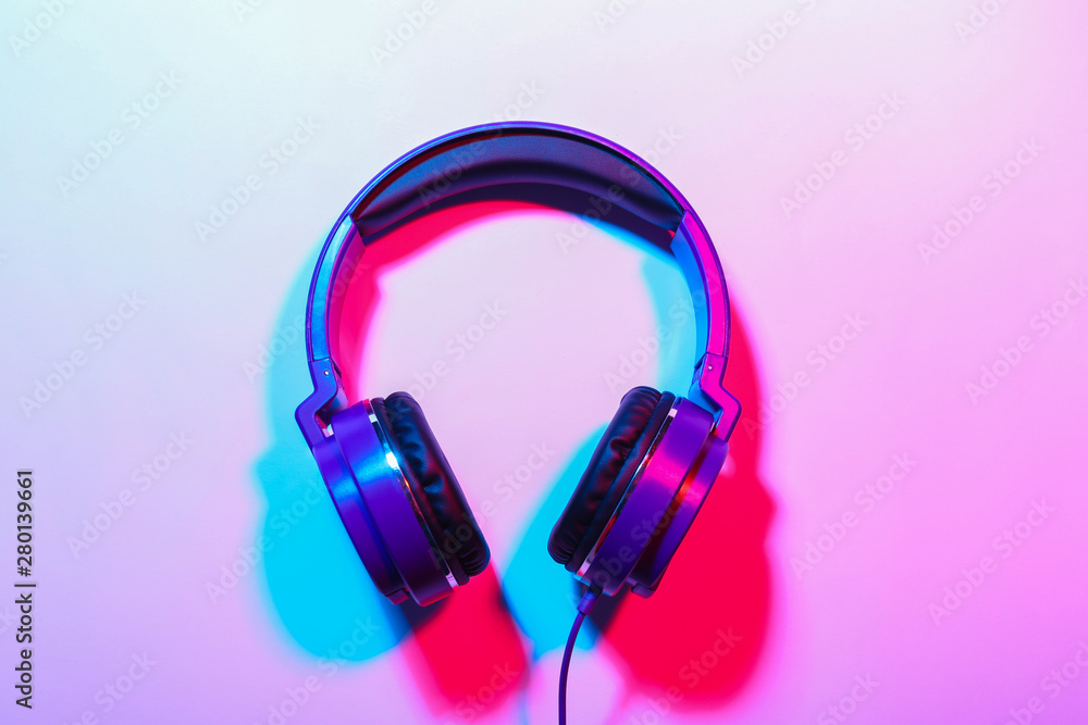 Stylish headphones on color background, top view Stylish headphones on color background, top view