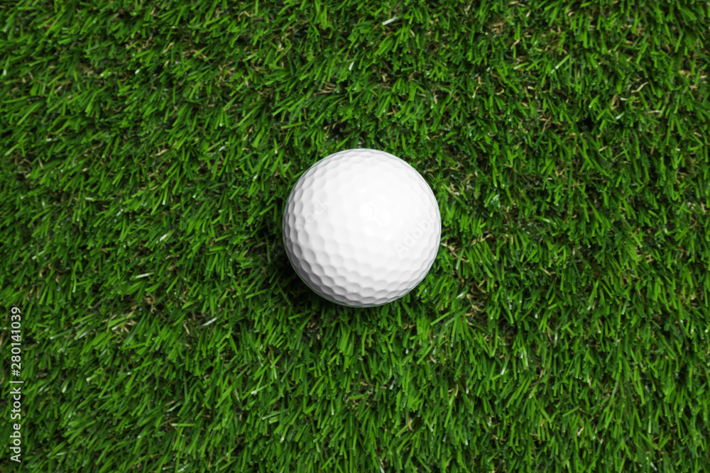 Golf ball on green artificial grass, top view Golf ball on green artificial grass, top view