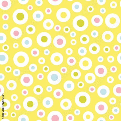 Yellow pattern with pink and yellow pastel dot and ring circle. Surface pattern design.