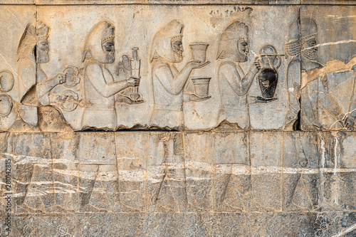 Obraz na płótnie Ancien inscriptions on the walls of Persepolis, the ancient capital of old Persian Achaemenid Empire in Iran, Zoroastrian symbol Faravahar w salonie