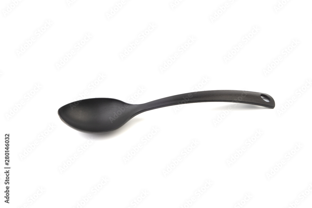 Black kitchen spoon utensils or kitchenware closeup isolated on white background Black kitchen spoon utensils or kitchenware closeup isolated on white background