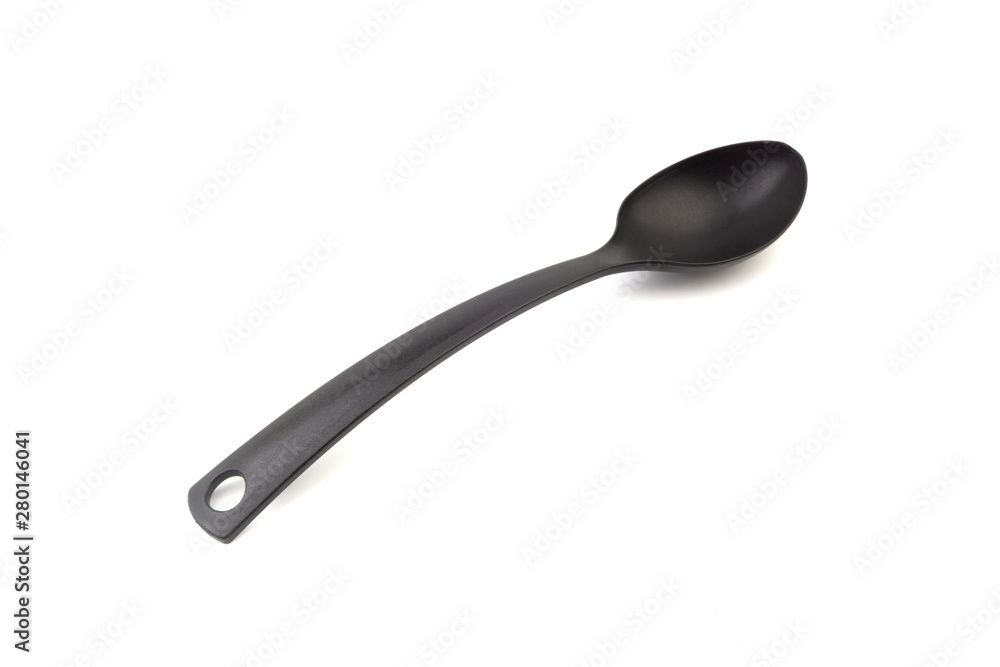 Black kitchen spoon utensils or kitchenware closeup isolated on white background