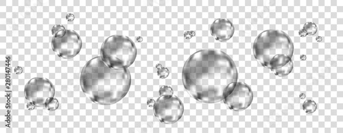 Underwater  black fizzing air bubbles on white  background.
