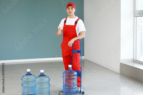 Delivery man with bottles o...