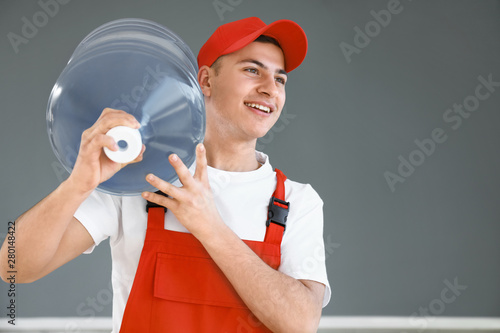 Delivery man with bottle of...
