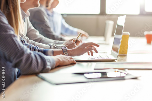 Young people having business meeting in modern office photo