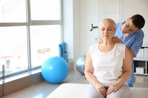 Physiotherapist working wit...
