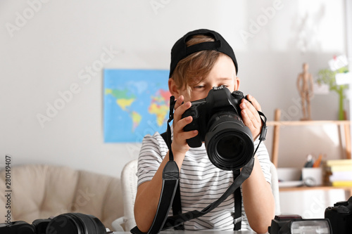 Cute little photographer wi...