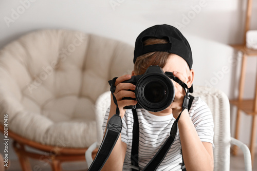 Cute little photographer wi...