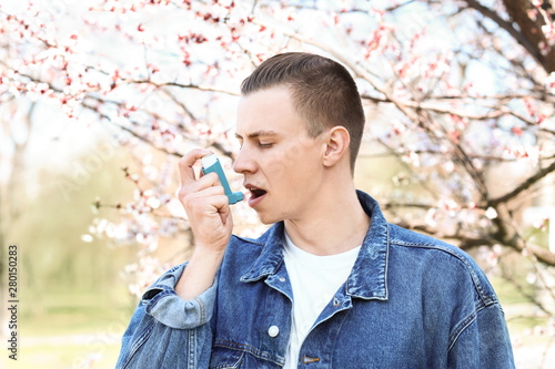 Man with inhaler having ast...