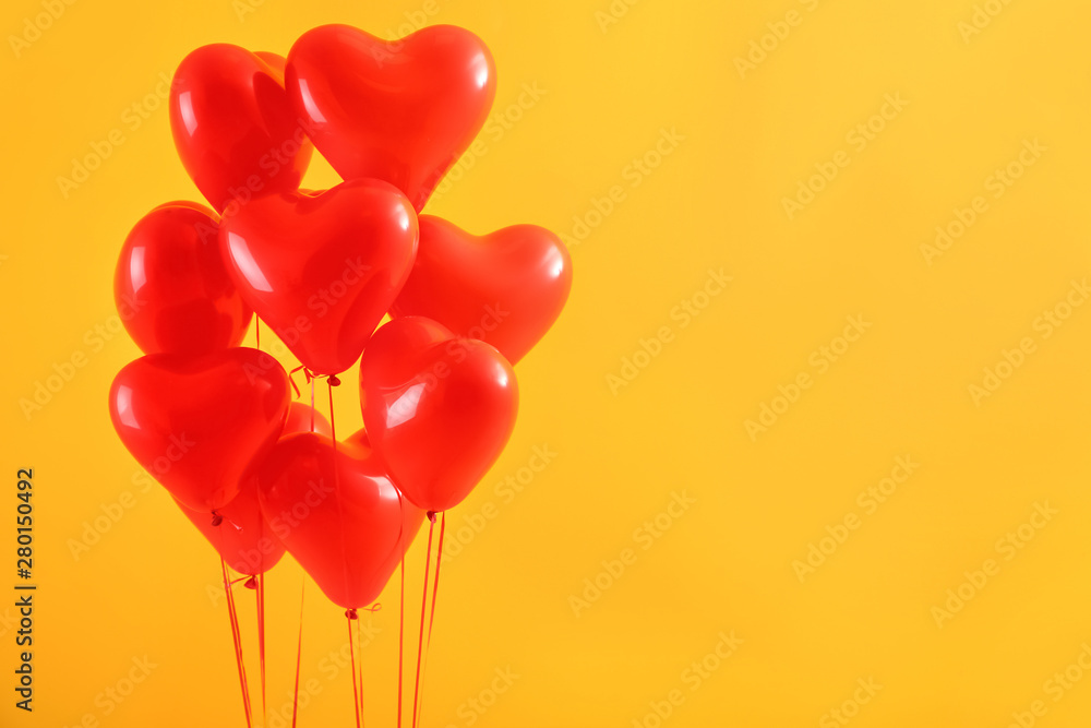 Heart-shaped air balloons on color background Heart-shaped air balloons on color background