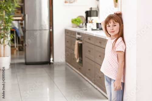 Little girl measuring heigh...