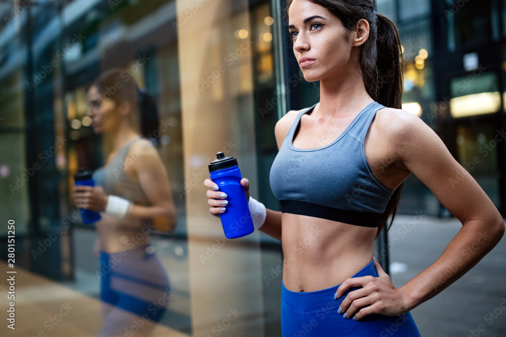 Young happy woman runner jogging in city outdoor Young happy woman runner jogging in city outdoor