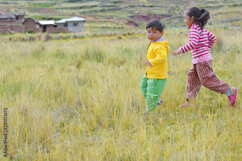 Latin children playing in the countryside. photo