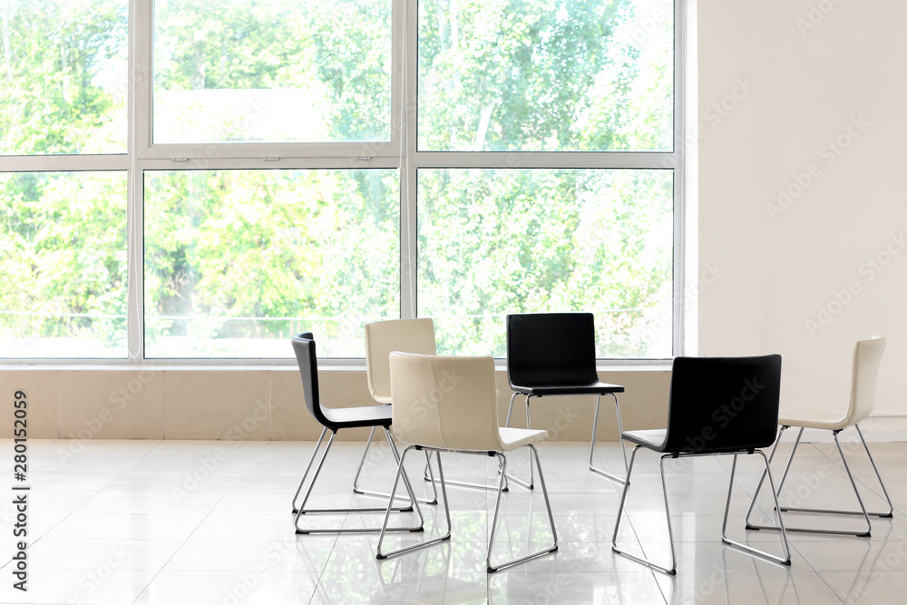 Empty chairs prepared for group therapy indoors Empty chairs prepared for group therapy indoors