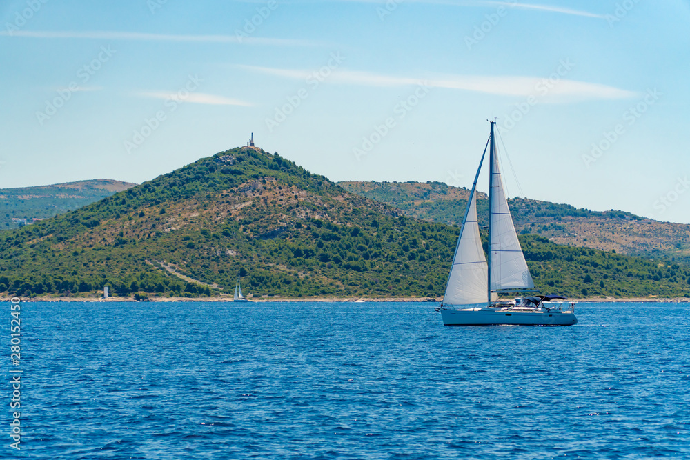Obraz premium Lonely Yacht sailing on opened sea, Croatia
