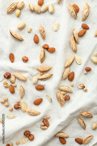 Many almonds on white cloth